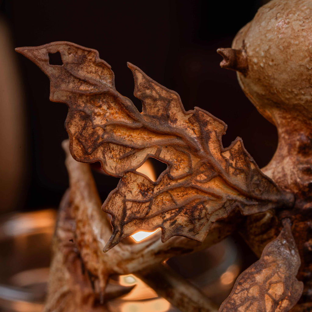 3D printed Tooth Fairy Hellboy figurine with skeletal wings, sharp claws, and a grotesque grin holding a tooth, surrounded by scattered white teeth. Hand-painted in bone, red, and brown tones, this dark fantasy collectible doubles as a tooth holder, making it perfect for gothic decor, horror props, or a unique keepsake for children’s lost teeth.